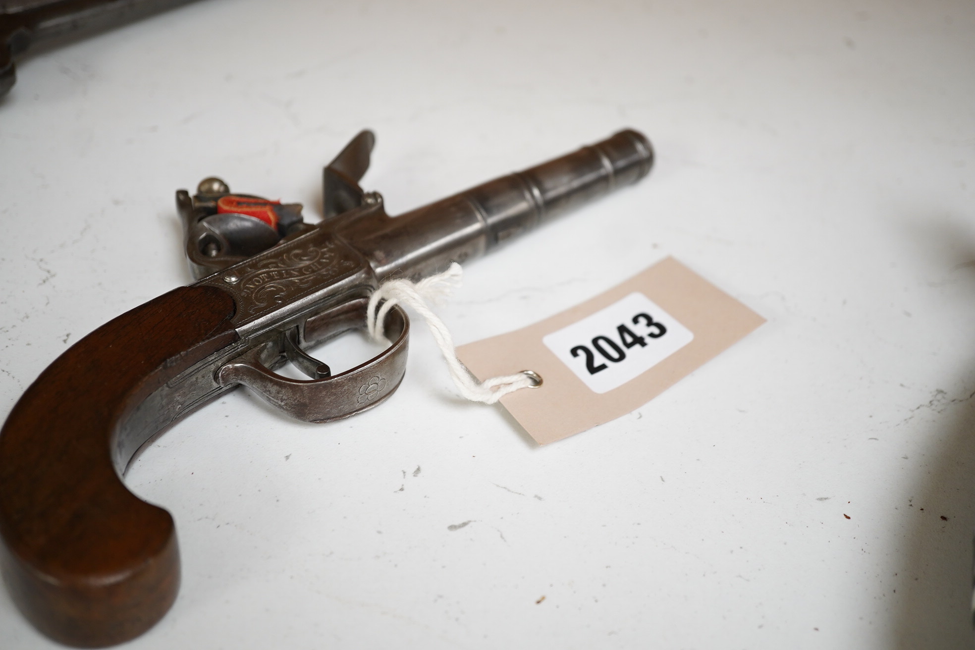 A six shot .36 Colt Navy single action percussion revolver, number 1875 (matching), regulation under lever rammer, signed barrel, roll engraved cylinder, brass mounts with traces of plating and single piece walnut grip,